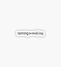 tanning over studying Sticker