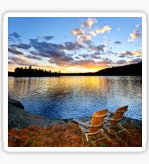 Wooden chairs at sunset on beach Sticker