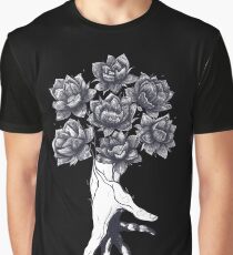 Hand with lotuses on black Graphic T-Shirt