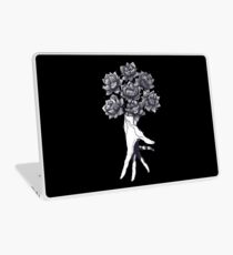 Hand with lotuses on black Laptop Skin