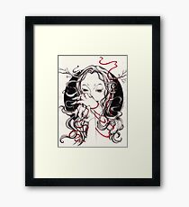 Witch with red string Framed Print