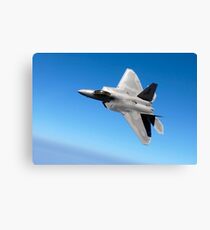 An F/A-22 Raptor banks during a training sortie. Canvas Print