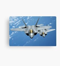 Two F-22 Raptors fly over the Pacific Ocean. Canvas Print