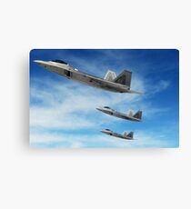 A three-ship formation of F-22 Raptors. Canvas Print