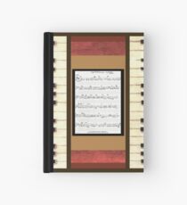 Piano keys with sheet music by Kristie Hubler Hardcover Journal