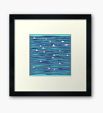Origami boat on the sea Framed Print