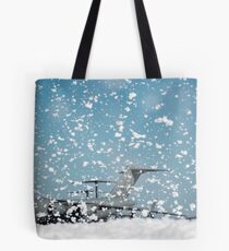 A C-17 Globemaster III on the flight line as fire retardant foam is released. Tote Bag