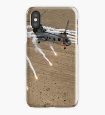 A U.S. Marine Corps CH-46 Sea Knight helicopter launching flares over the desert near Al Taqqadum, Iraq. iPhone Case
