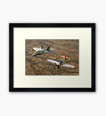 A World War II-era P-47 Thunderbolt and an F-22A Raptor fly in formation. Framed Print