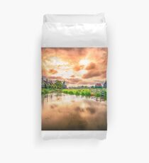 Traditional village with dutch windmills and river at sunset, Holland, Netherlands. Duvet Cover
