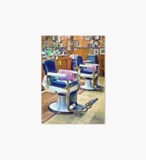 Two Barber Chairs With Pink Striped Barber Capes Art Board