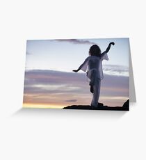 Woman practicing Tai Chi at sunset outdoorsa art print Greeting Card