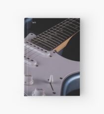 Electric guitar on wooden background, close up Hardcover Journal