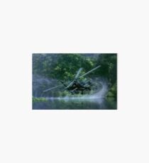 Military apache helicopter gunship flying close to the river Art Board