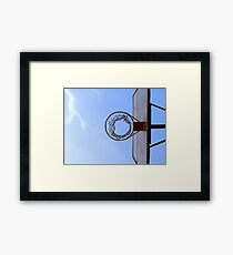 Basketball court and a clear blue sky Framed Print