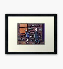 Little brother kicking big brother Framed Print