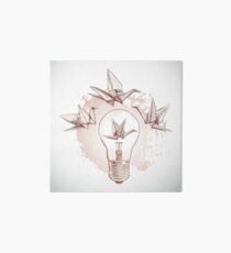 Origami paper cranes and light Art Board
