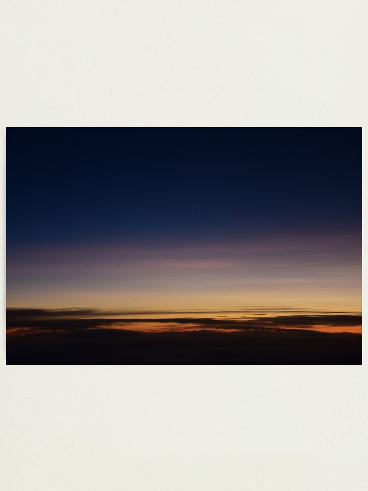 Alternate view of Moon rising above the clouds; sunset above clouds; sunset; moon Photographic Print