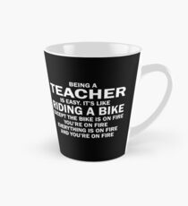BEING A TEACHER IS EASY.IT'S LIKE RIDING A BIKE EXCEPT THE BIKE IS ON FIRE YOU'RE ON FIRE EVERYTHING IS ON FIRE AND YOU'RE ON FIRE Tall Mug