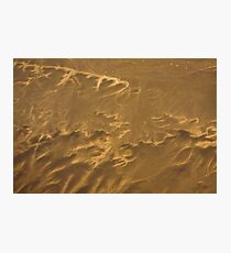 Tie dyed hearts strung in the sand Photographic Print