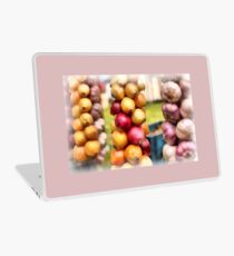 Decorative onions hanging on a string on a farmers market Laptop Skin