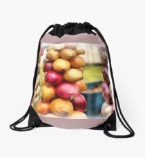 Decorative onions hanging on a string on a farmers market Drawstring Bag