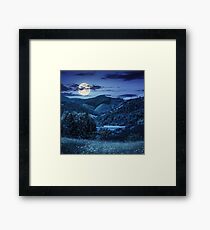 pine trees near meadow in mountains at night Framed Print