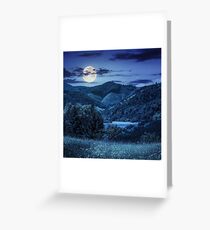 pine trees near meadow in mountains at night Greeting Card