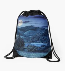 pine trees near meadow in mountains at night Drawstring Bag