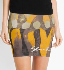 Women in Gray and Gold Mini Skirt