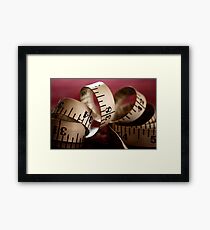 Measuring up Framed Print