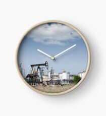 oil pump jack and refinery on field Clock