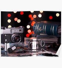 A mug on old photos. in the background of an old camera and photo albums. Poster