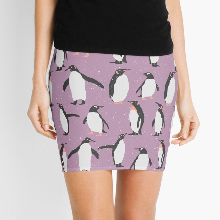 "Happy Penguins and Snow on a purple background" Mini Skirt by