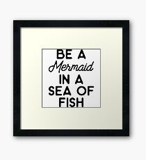 Be a mermaid in a sea of fish. Framed Print