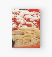 spaghetti with tomatoes and olives food background Hardcover Journal