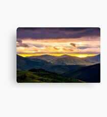 mountain rural area in springtime at cloudy sunset Canvas Print