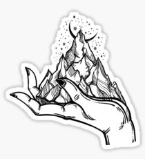 Mountains in hands, tattoo. Wilderness on a palm. Symbol of travel, tourism, meditation t-shirt design, surreal graphics. Sticker