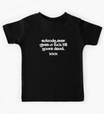 Nobody ever gives a fuck till youre dead. Kids Tee
