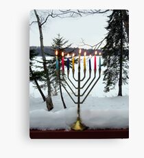 Lighted Chanukah Menorah in Snow Against Frozen Lake Canvas Print