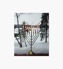 Lighted Chanukah Menorah in Snow Against Frozen Lake Art Board