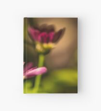Close up of two red flowers Hardcover Journal