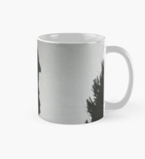 Wedding guests walking holding in silhouette at sunset in marriage party silver gelatin black and white 35mm negative analog film photo Mug