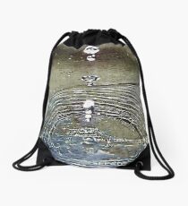 Molecules vibrating in harmony with radiant energy. Drawstring Bag