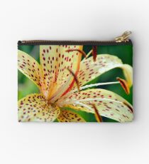 Yellow lily speckled macro growing in garden Studio Pouch