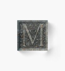 'M' written in Stone Acrylic Block