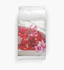 Red, pink and white flowers in a white cup Duvet Cover