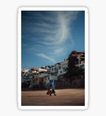 Man walking on the moroccan beach at sunrise in Taghazout Sticker