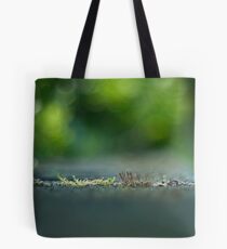 despite adversity, life prevails Tote Bag