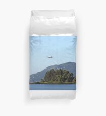 airplane flying over Mouse island Corfu Greece Duvet Cover